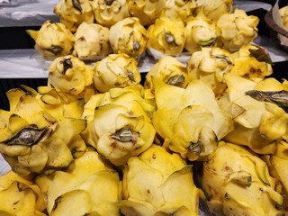 Close-Up of Fresh Yellow Dragon Fruits at a Market