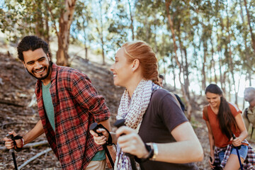 Young and diverse group of friends and hikers hiking together in the mountains of south africa