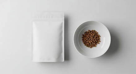 White stand-up pouch and bowl of brown grains on white background.