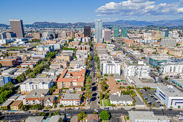 Los Angeles, California – October  29, 2024: Aerial drone village home community photo toward LA Koreatown James M Wood Blvd, 8th St, Vermont Ave with streets, apartments, buildings, downtown LA, Wils