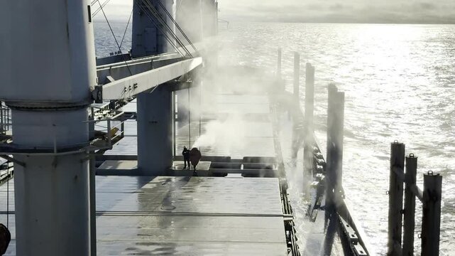 high pressure water blaster on board the cargo ship