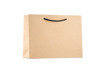 Minimal kraft paper shopping bag with black rope handle isolated on white background, blank for branding. Concept of sustainable packaging, recyclable materials and eco-friendly retail mockup
