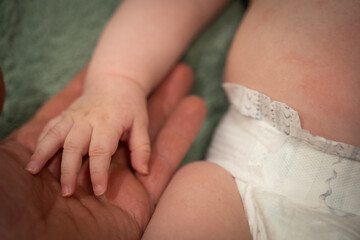 hands of father and daughter