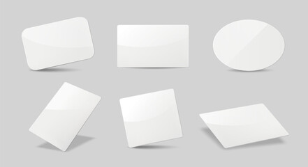 Collection of glossy blank white cards with different shapes and angles, minimal style on gray background. Concept of templates and mockups. Vector illustration
