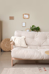 Interior of cozy living room with couch and frames