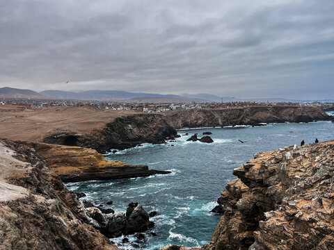 Spectacular view of cliffs, Pacific ocean and condors flying over view point next to Mollendo in southern Peru. It is located in the Arequipa Region and is the capital of both the Islay Province.