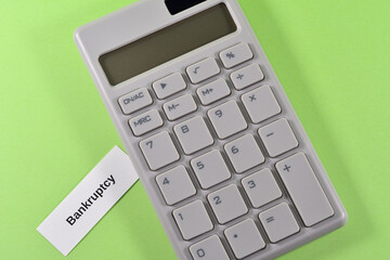 Photo of a calculator and bankruptcy