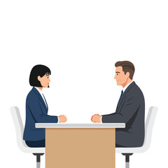 Two business people, a man and a woman, sit at a table facing each other.