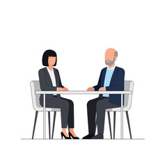 Two business professionals seated across a table in a formal meeting.