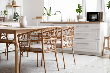 Dining table and chairs in interior of modern kitchen