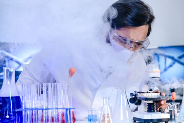 A dedicated Indian researcher analyzes a biological sample in a lab, contributing to medical...