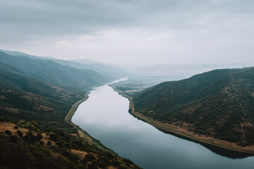 breathtaking view of reservoir edge in iran under overcast sky captured from topdown perspective
