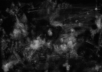 Dark grunge abstract background. White paint stain on black background. Dust and scratches overlay backdrop.