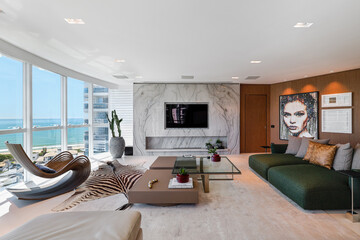 Stylish Coastal Living Room with Green Sofa & Panoramic City Views