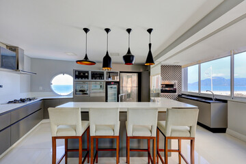 right Minimalist Kitchen with Central Island and Bar Seating