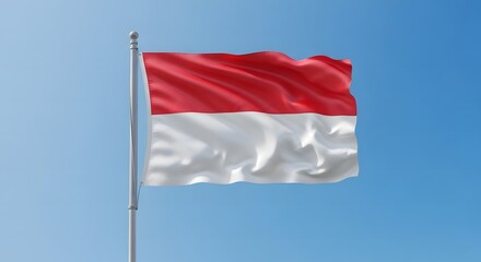 Indonesian flag waving against a clear blue sky, showcasing the red and white colors.