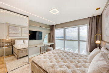 Modern City‑View Bedroom with Wood Accent Wall and Natural Light