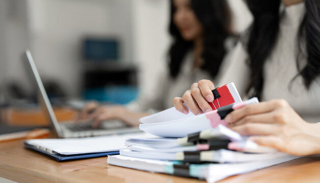 Business Documents, Auditor businesswoman checking searching document prepare paperwork or report in workplace