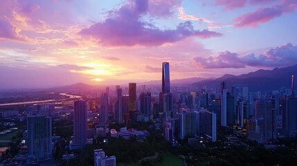 Fototapeta premium Aerial View of Modern Cityscape at Sunset with Vibrant Clouds and Skyscrapers Against Dramatic Sky