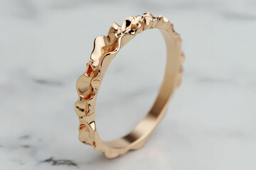 Rose gold ring with textured band on marble