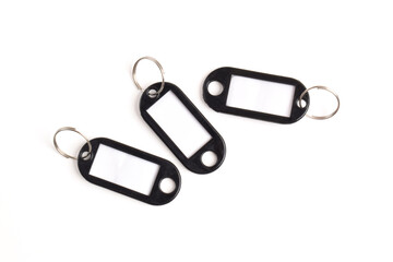 Black plastic key tag isolated on white background
