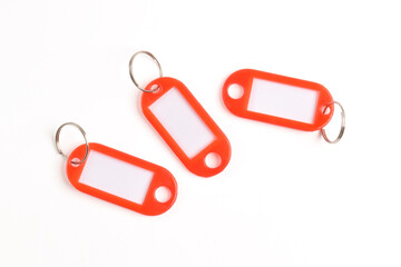 Red plastic key tag isolated on white background