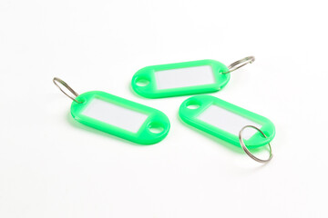 Green plastic key tag isolated on white background