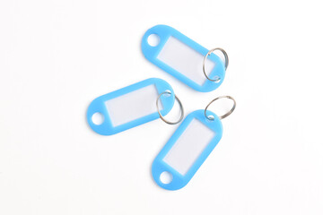 Light blue plastic key tag isolated on white background