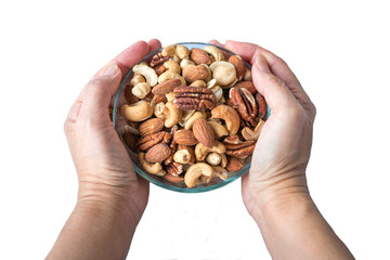 Hand holding a bowl of healthy nuts. High angle view. Isolated on transparent background.