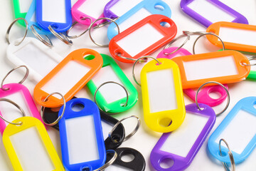 Colorful plastic key tag isolated on white background
