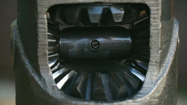 Close up view of car differential gears rotating smoothly inside car transmission, showcasing complex mechanics of automotive power transfer. Car differential gears rotating inside car transmission
