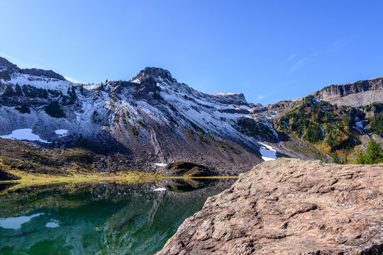 Mountain lake with blue sky and snow mountains in Vancouver, Canada, North America. Day time on July 2025. - Powered by Adobe