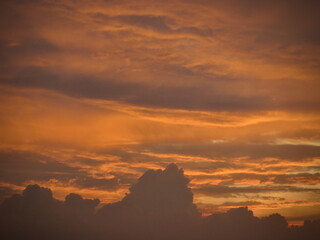 Golden Hour Cloudscape Over Urban Silhouette at Dusk on West Lake in Hanoi, Vietnam