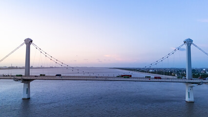 aerial view bridge over river during sunset
