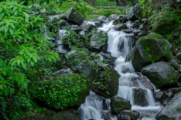 A waterfall during the monsoons near Pune India. Monsoon is the annual rainy season in India from June to September.
