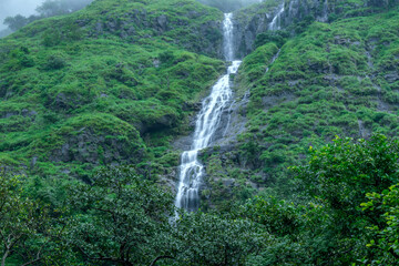 A waterfall during the monsoons near Pune India. Monsoon is the annual rainy season in India from June to September.