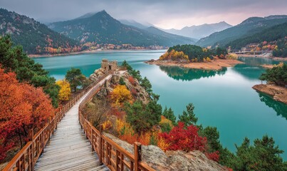 Autumnal mountain lake vista with wooden walkway