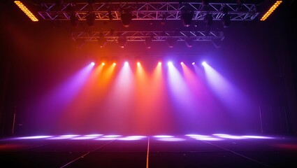 Combination of orange and purple stage lights with vibrant effect focusing at the center of the empty stage background