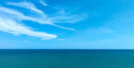 Nature of the ocean and blue sky Summer with sunshine, sandy beaches, clear blue waters sparkling against the blue sky. on an island with good ecology and environment Background for summer vacation