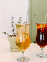 Refreshing iced beverages served with a stylish presentation in a cozy cafe setting
