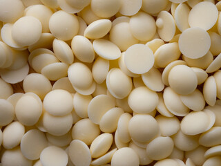 White chocolate chips Pistols buttons. Confection and pastry concept.