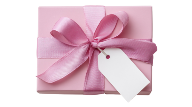 pink ribbon, pink landscape box with white gift tag attached to the ribbon. Shot from above on a white background.