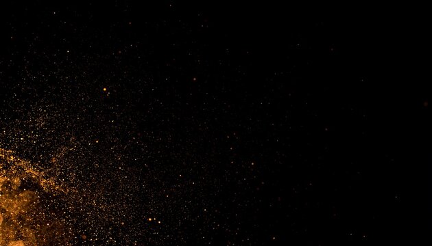 Abstract burst of orange particles on black background
