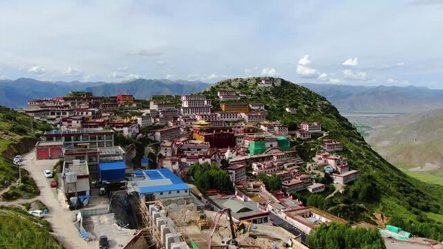 Explore Ganden Monastery, one of Lhasa's major temples in Tibet, showcasing stunning aerial views and majestic landscapes