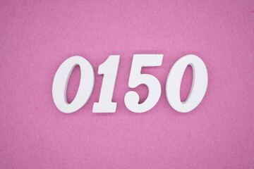 The numbers are made of white painted wood, placed on a pink paper background.