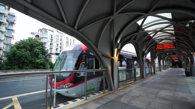 Chengdu BRT rapid transit station live action during busy evening commute hours