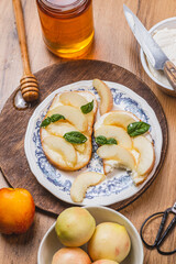 Bruschetta with ricotta and nectarines, garnished with honey and basil