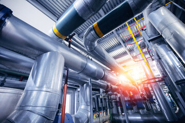 Concept background industrial factory zone. Steel pipelines, valves and ladders modern gas power...