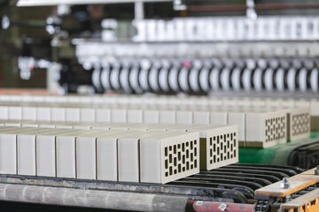 Automated brick production process with conveyor belt and quality control