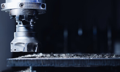 Precision cnc milling machine processing metal in industrial setting